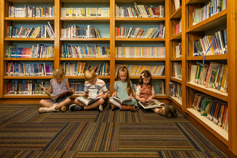 young students reading in the library